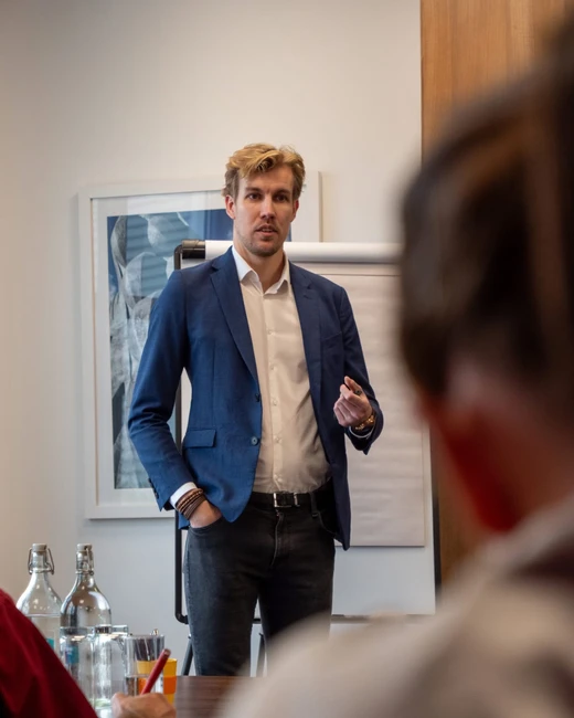 Andreas Andresen presenting to a room of property sourcers